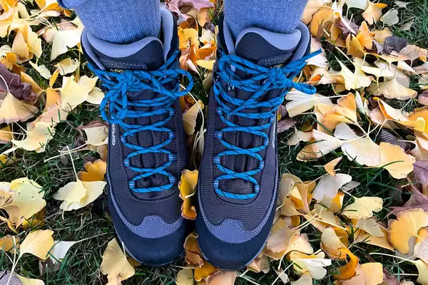 A person stands outside while wearing the Asolo Arctic GV Women’s Hiking Boot