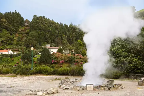 A plume of steam coming out of the ground in the Azores.