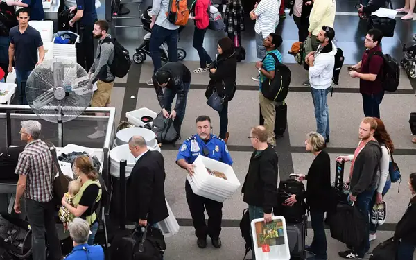 Travelers, at Denver International Airport