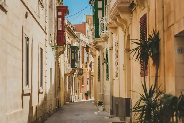 Empty alleyway with colorful buildings