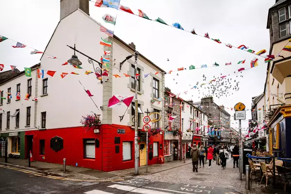 Flags flying over a pedestrian street