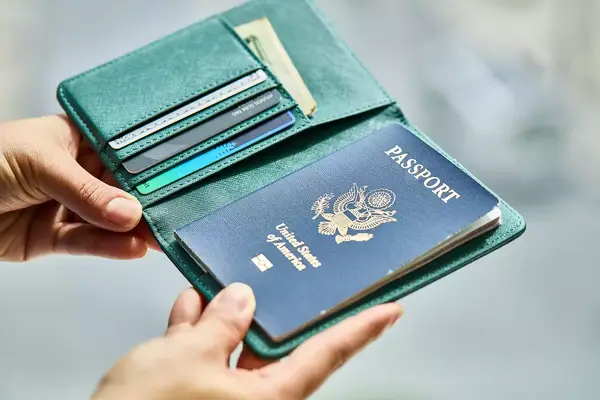The front of a passport inside a passport holder. 