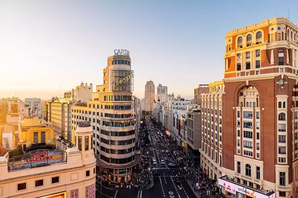 Madrid cityscape with Gran Via street at sunset, aerial view, Spain