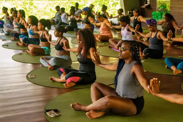 A group of women practicing yoga in Bali