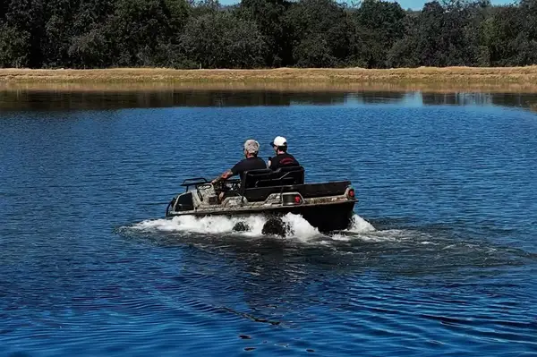 Guy Fieri and his son Hunter in a UTV