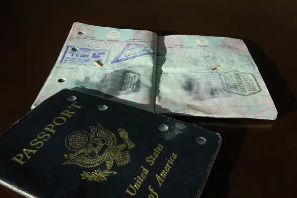 A damaged water soaked United States Passport from a Phuket Thailand Tsunami Survivor shot late in the day with natural side light.