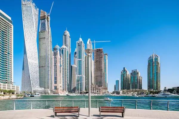 Two benches overlooking the Dubai skyline and marina