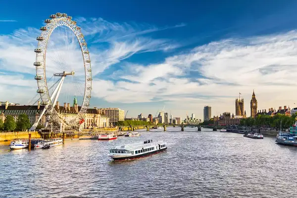 Westminster Parliament, Big Ben and the Thames with blue sky, London