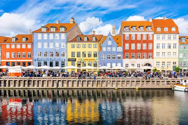 Multicolored houses along the canal in Nyhavn harbor, Copenhagen, Denmark