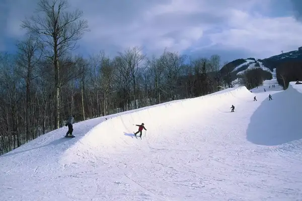 Skiers on Mount Cannon