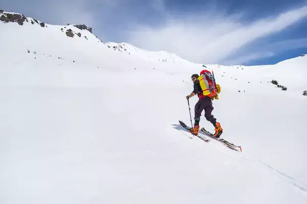 Man backcountry skiing Mt. Shasta in California