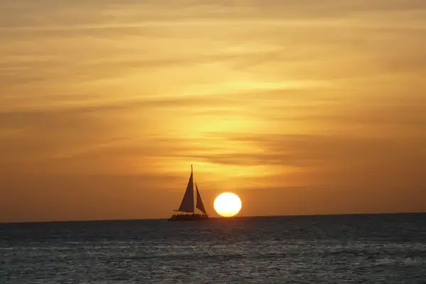 A sailboat in the sunset on Aruba