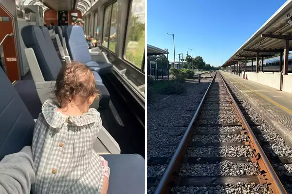 A baby on an amtrak train and train tracks