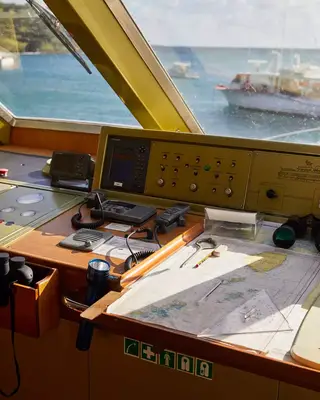 The bridge of a yacht, showing a map and instruments