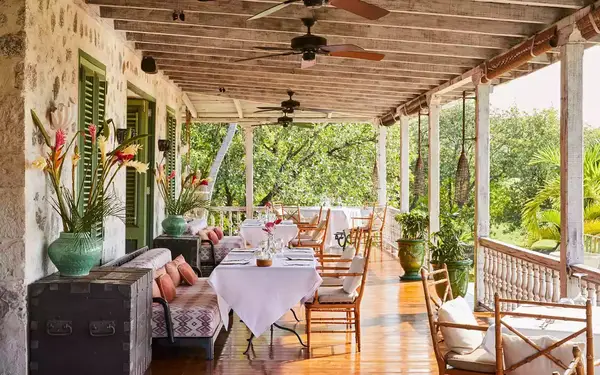 The open air Veranda restaurant at Cotton House hotel on the island of Mustique