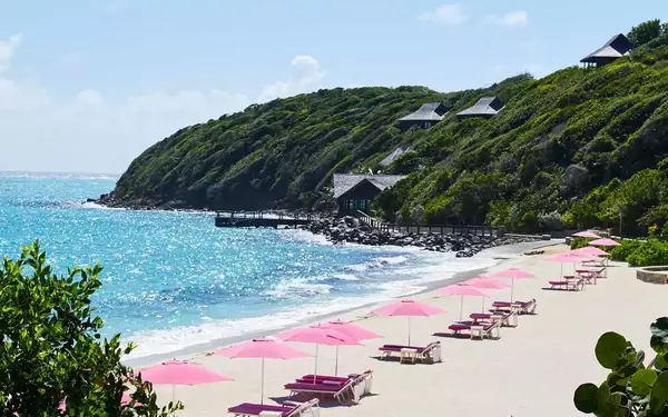 Pink umbrellas on the beach at the Mandarin Oriental, Canouan