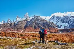 Argentina, Patagonia, El Chalten, couple on a hiking trip kissing at Fitz Roy massif
