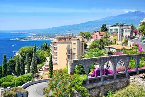 Taormina town with Mount Etna on background
