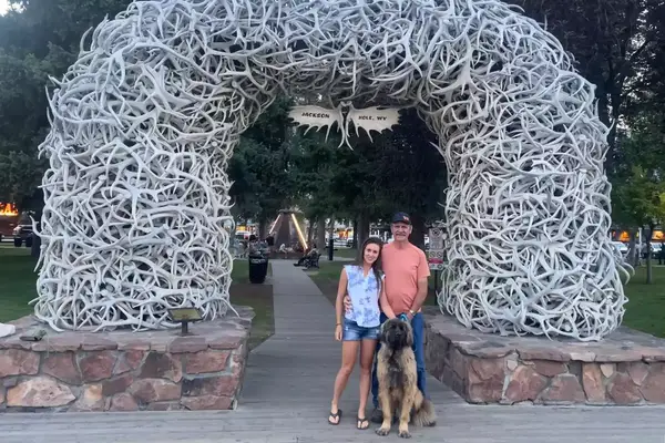 A father and daughter with a dog in Jackson Hole, WY