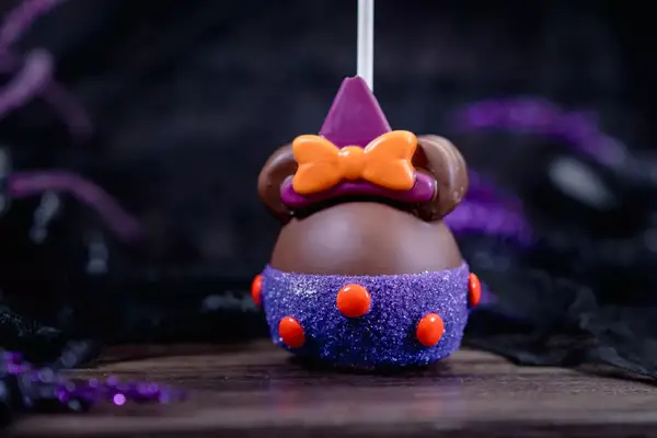 Candy apple decorated as Minnie Mouse Witch