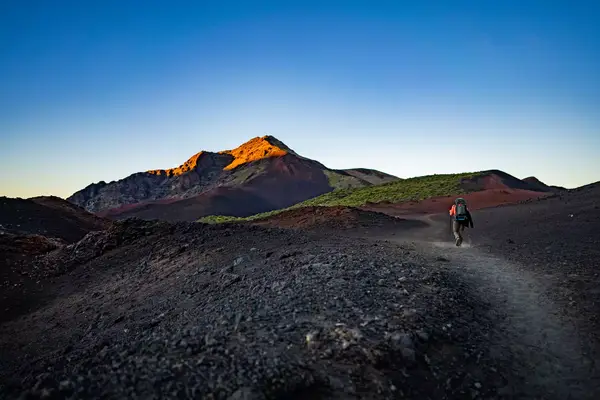 Hiker in a mountainous landscape.