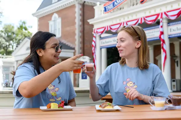 Friends eating dessert together at Disney