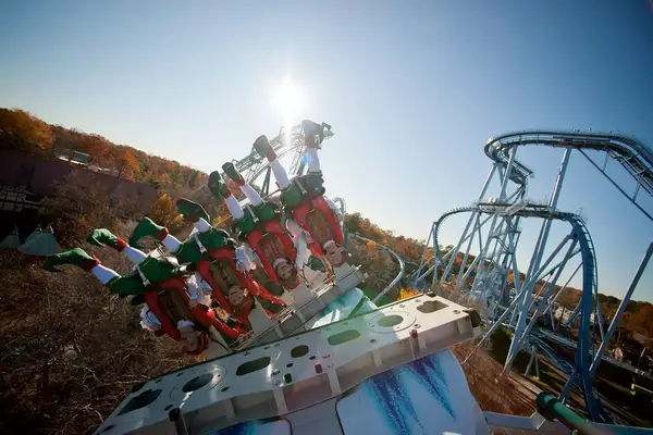 people dressed as he Christmas Town elves ride Busch Gardens
