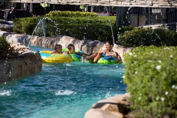 A family in tubes goes through the lazy river