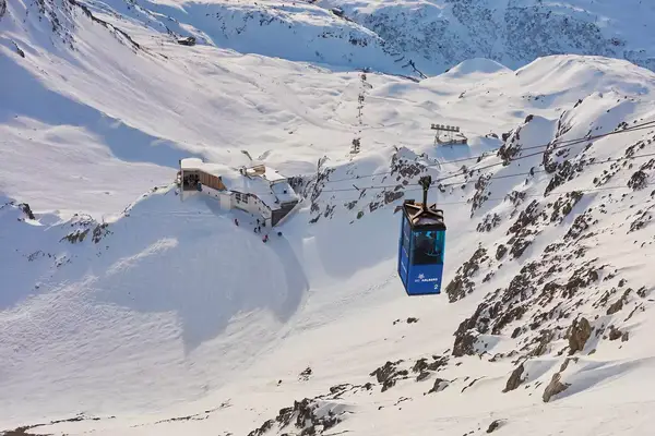  Alpine skier and cable car up to the Valluga on January 8, 2014 in St.Anton, Tyrol, Austria. 