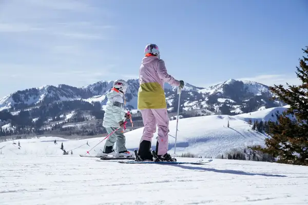 Adult and child on skis in Deer Valley, Utah
