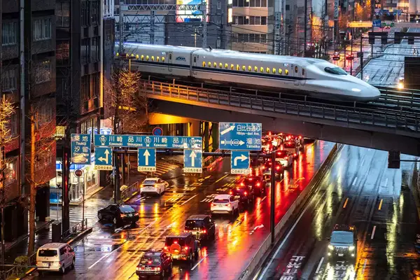 A shinkansen N700A series, or high speed bullet train, arrives at night in Tokyo