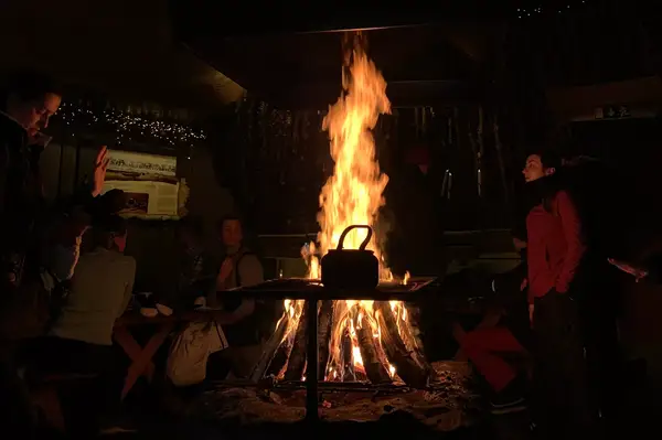 a tent with a fire in Abisko, Sweden