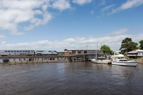 The City of New Orleans crosses Pass Manchac near Akers, La. Pass Manchac connects Lakes Pontchartrain and Maurepas.