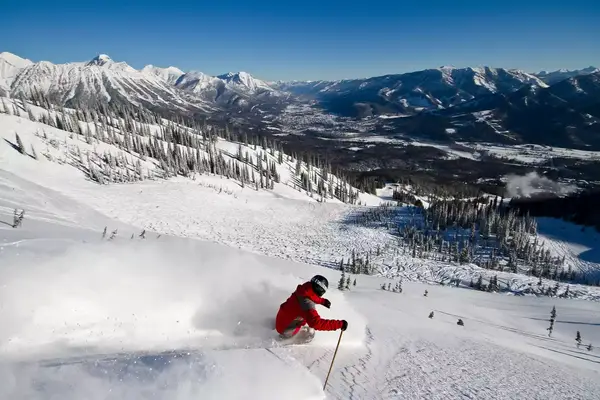 A skier going down a mountain