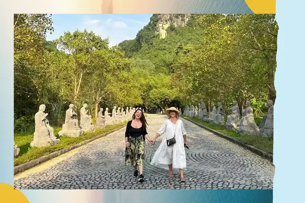 Mother and daughter holding hands walking in Asia