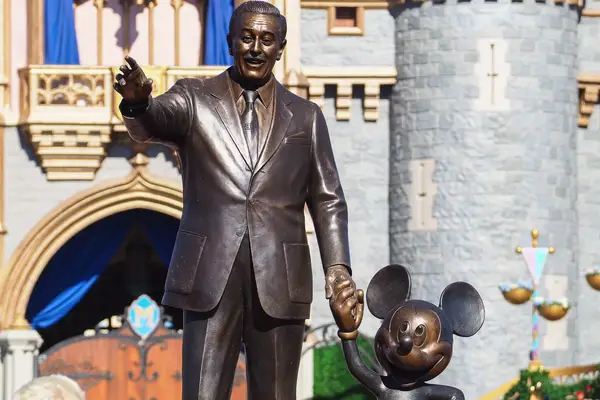 Statue of Walt Disney holding Mickey