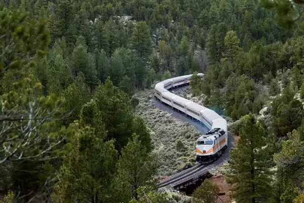 Aerial view of The train going through mountains by The Grand Canyon Railway & Hotel