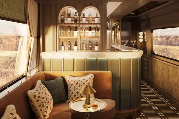 Luxury train car interior, features a bar with bottles on display and elegant seating
