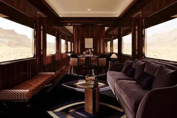 Luxurious train cabin interior with plush seating and a dining area, panoramic windows displaying a scenic landscape view