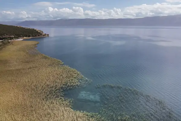 Aerioal view of a lake with ruins of a submerged ancient settlement