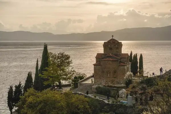 Sunset in a lake town, with a church shown