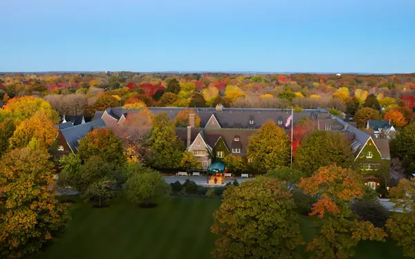 High-angle view of large resort surrounded by fall foliage
