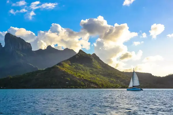 Sailboat with the lush island of Bora Bora in the background