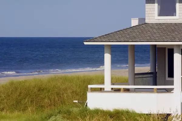 Beachside house porch with ocean in background