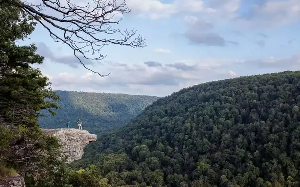 The beak-shaped Whitaker Point rock is seen jutting out over the tree-covered mountains of Arkansas