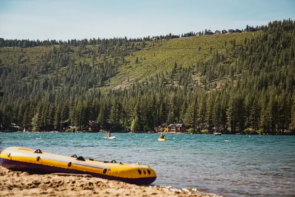 A yellow raft on the shore of Lake Tahoe