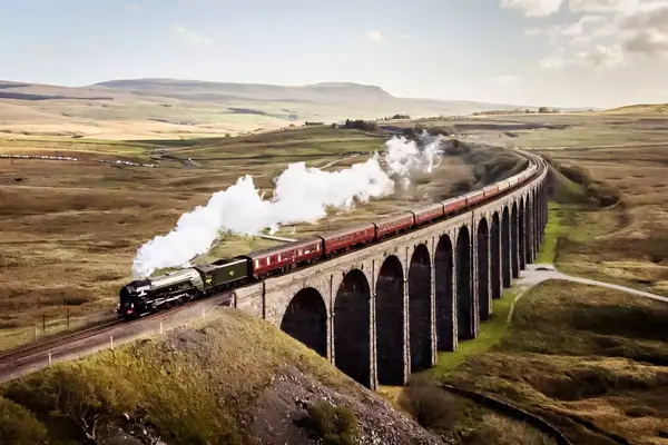 The Peppercorn A1 Pacific class 60163 Tornado steam locomotive hauls a special train over the Ribblehead viaduct as it travels through the Yorkshire 