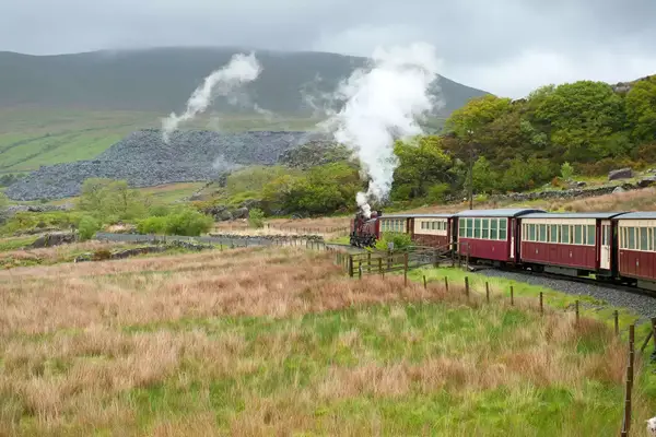 Welsh Highland Railway steam train operating between Caernarfon and Blaenau Ffestiniog, Snowdonia National Park. Wales. United Kingdom . 