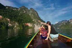 Visitors bird watch on CHEOW LAN LAKE in KHAO SOK NATIONAL PARK, THAILAND