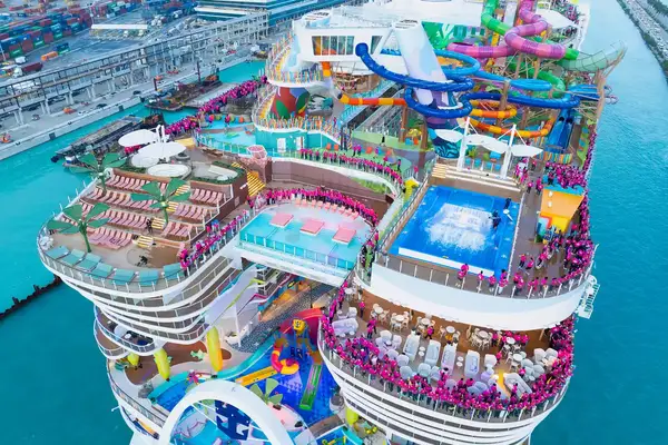 Aerial view of a Royal Caribbean cruise ship with passengers using the aquapark and pool deck